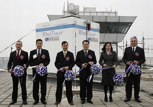 Dr Lee Boon-ying, Director of the Hong Kong Observatory (third from left) and representatives of Civil Aviation Department, Government Flying Service, International Air Transport Association, International Federation of Airline Pilots' Associations and the Guild of Air Pilots and Air Navigators cutting the ribbons to declare operation of the LIDAR for all runway corridors at the airport