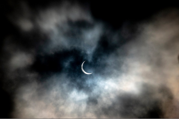 Partial Solar Eclipse Fascinates the City