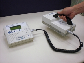The portable contamination survey meter checking for surface contamination