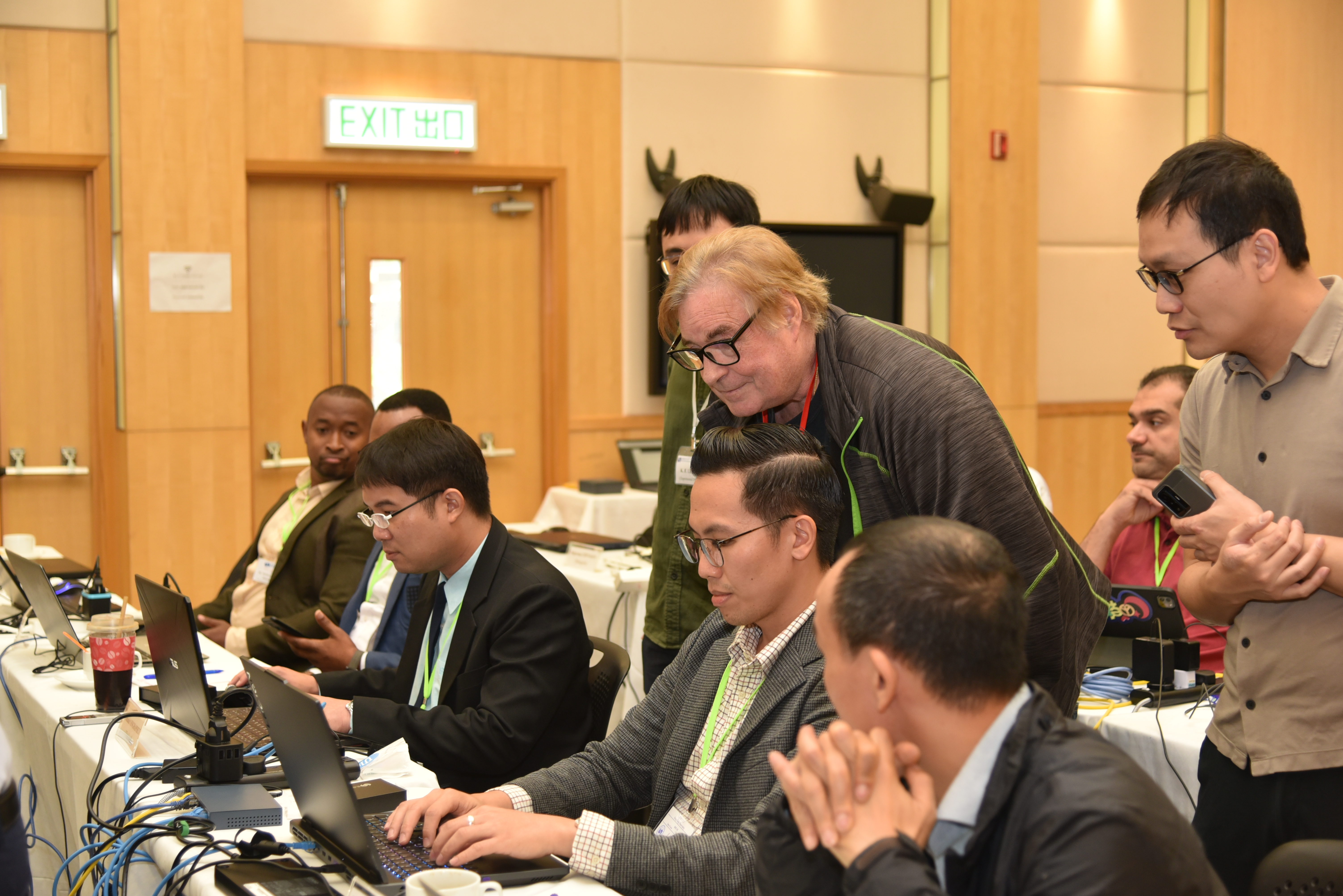 Mr Jeffrey ADIE guiding a practical session on running AI weather model forecast.