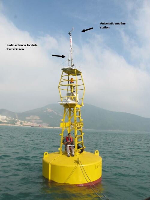 An Observatory colleague checking the instruments and the data on the weather buoy