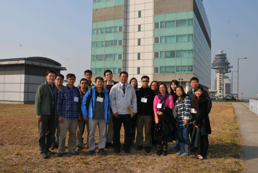 A group photo of visitors from Ho Koon Nature Education cum Astronomical Centre and Observatory's staff taken in front of the Air Traffic Control Complex in the Hong Kong International Airport
