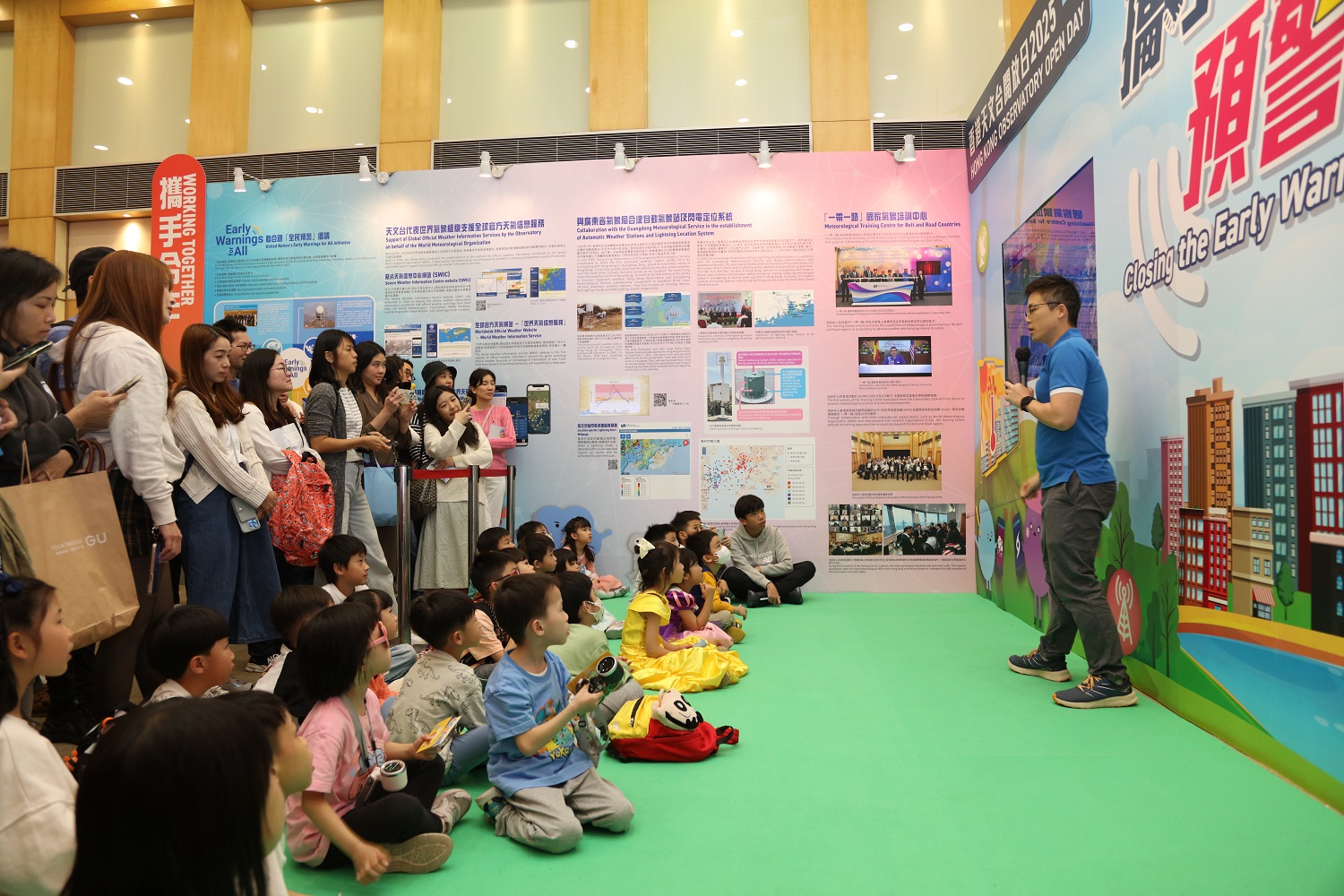 TV weather presenters giving live demonstration of weather reporting