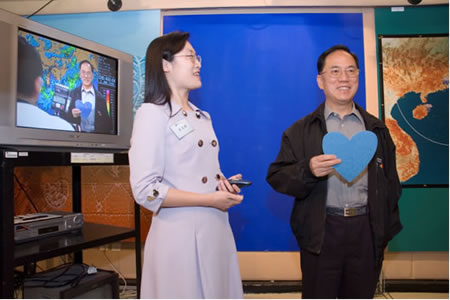 Mr Tsang experienced the chroma-key special effect in the Observatory TV Studio