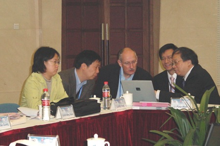 Friendly Discussions  (Drs. M.C. Wong and P.W. Li exchanging views with WMO and CMA experts)