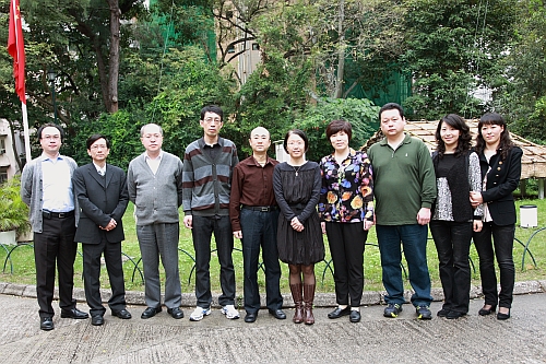 Ms. Sharon S.Y. LAU, acting Director of the Observatory (fifth from the right) photographed with the delegates led by Ms. LIU Yunxia, Deputy Director of the Meteorological Service Department of Northeast Regional ATMB, CAAC (fourth from the right) in front of the weather observational site of the Observatory's Headquarters.
