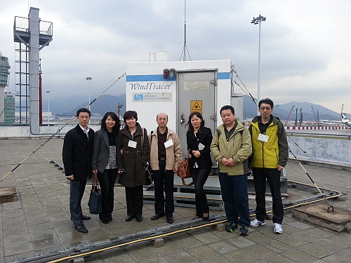 The delegates photographed with Observatory staff in front of the LIDAR.