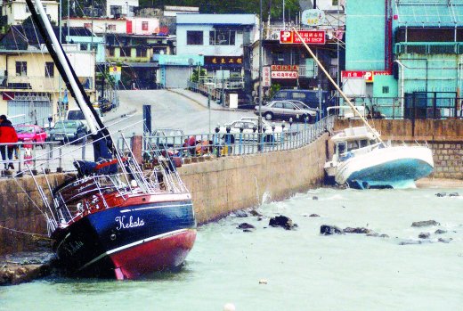Yachts blown ashore in Sai Kung
