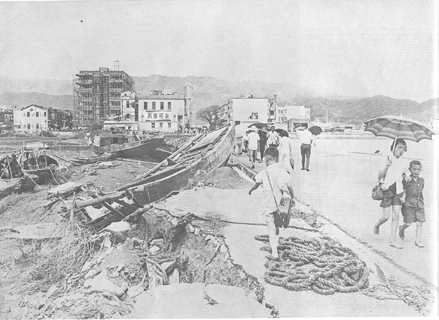 Sampans washed over the road near Tai Po