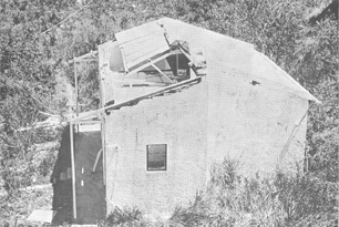 A low-pitched roof near Shek Pik damaged by positive pressure forces