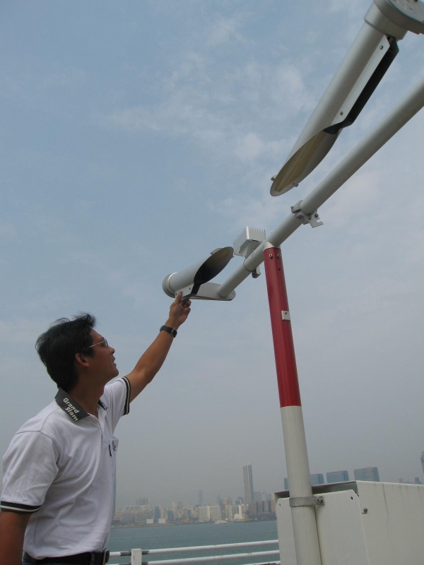 Figure 1	The Observatory's Radar Specialist Mechanic is inspecting the visibility meter installed at Central