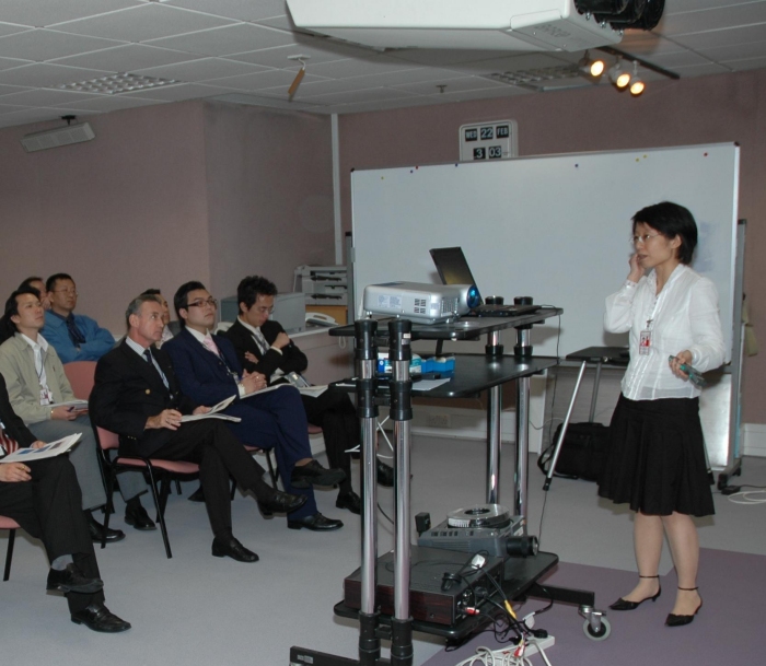 Figure 1.   Ms. Sharon Lau of the Observatory delivering a presentation to the participants of the training course.