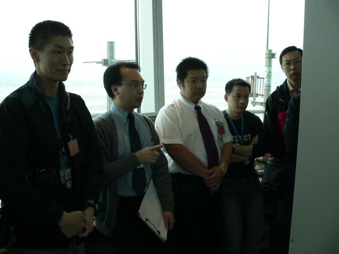 Figure 2.   HKO staff discussed with the dispatchers during a visit to the Observatory's Airport Meteorological Office