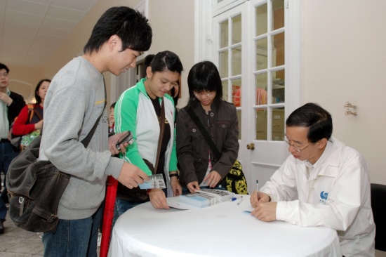 Fig 3: The Director, Mr C Y Lam, autographing for the enthusiastic visitors.