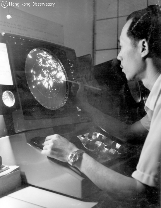 An Observatory personnel at work in front of a display of Plessey 43S radar