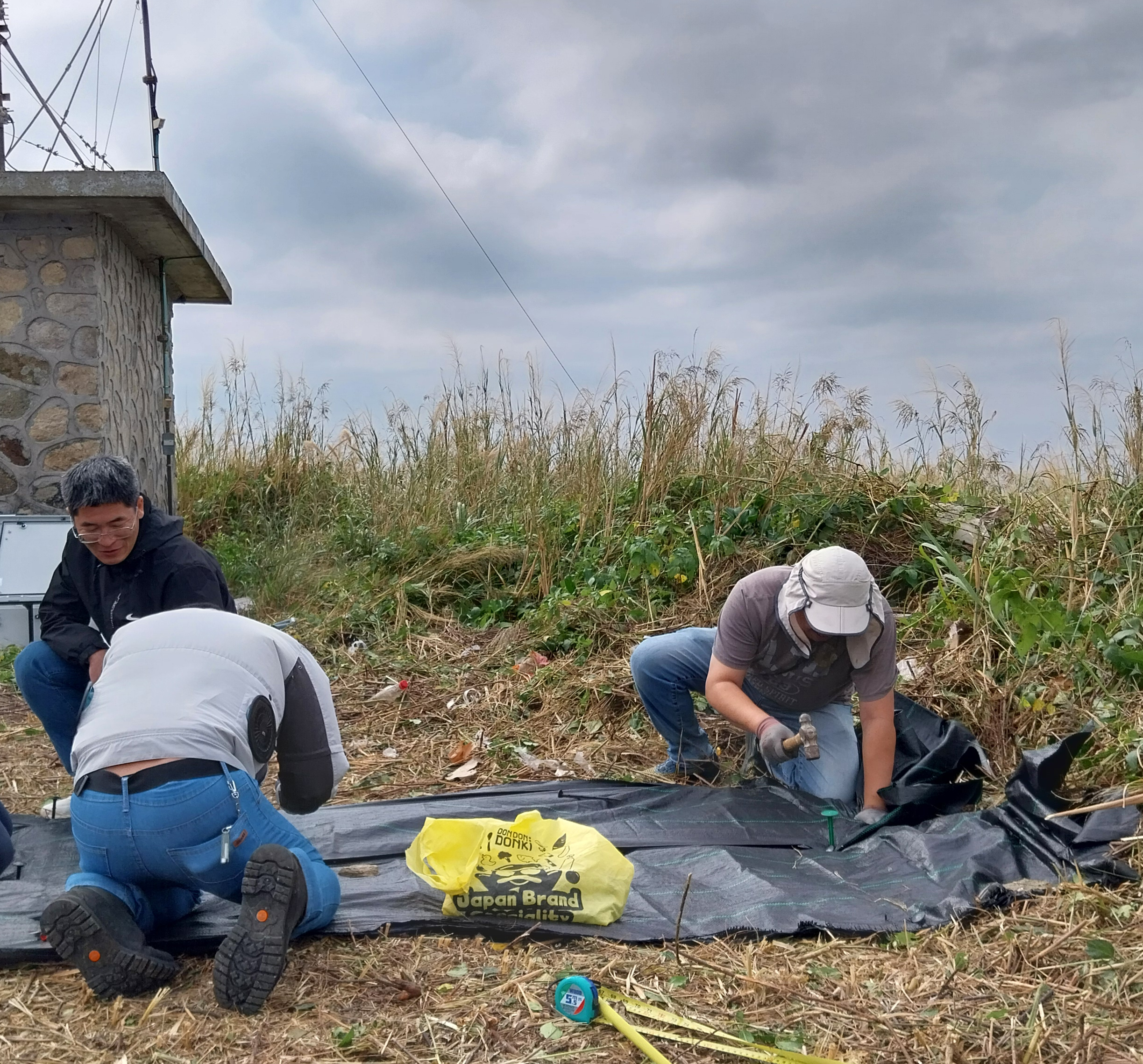The Huangmao Zhou seismic station construction team forming the site