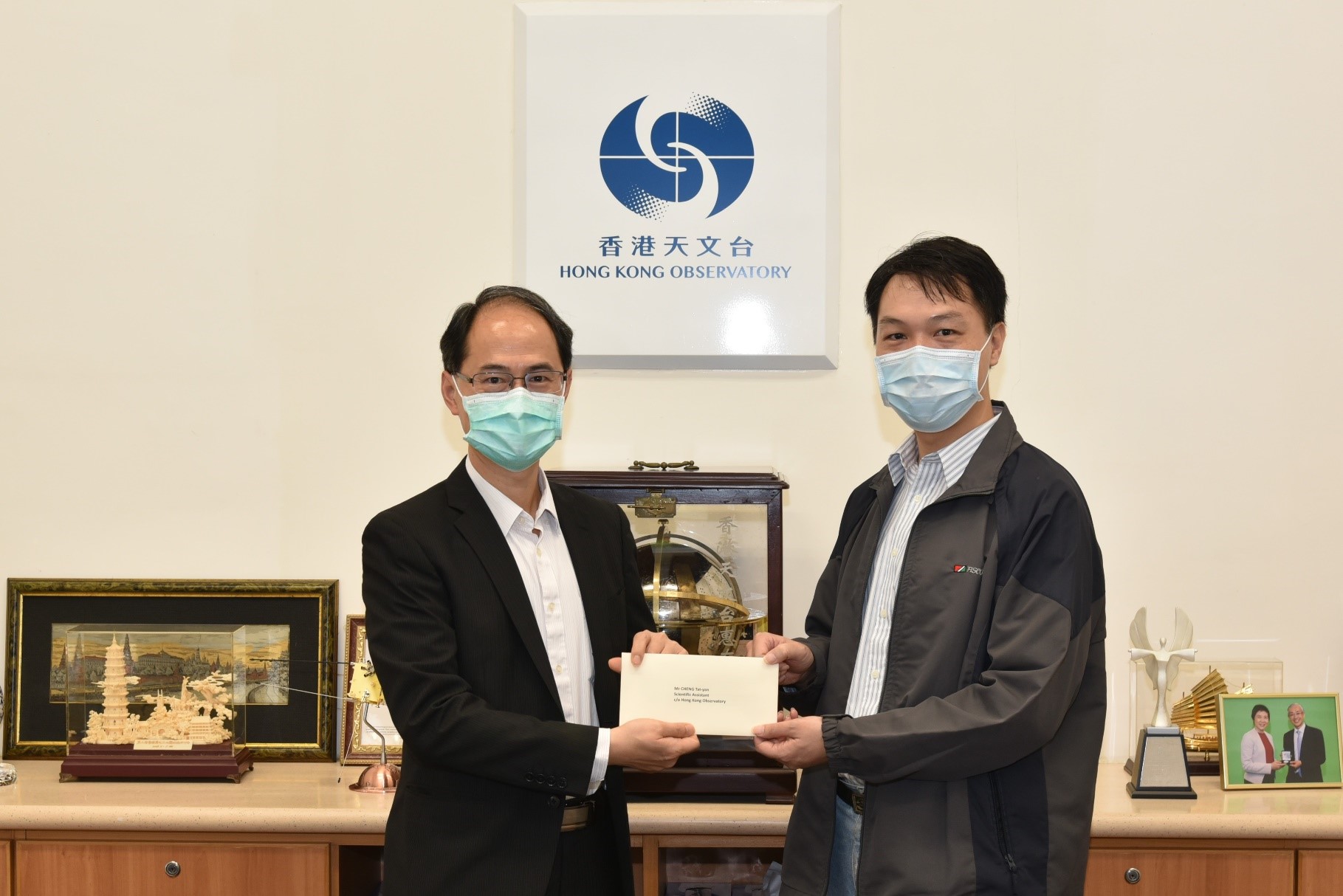 Mr Cheng Tat-yan (right) was promoted to Senior Scientific Assistant