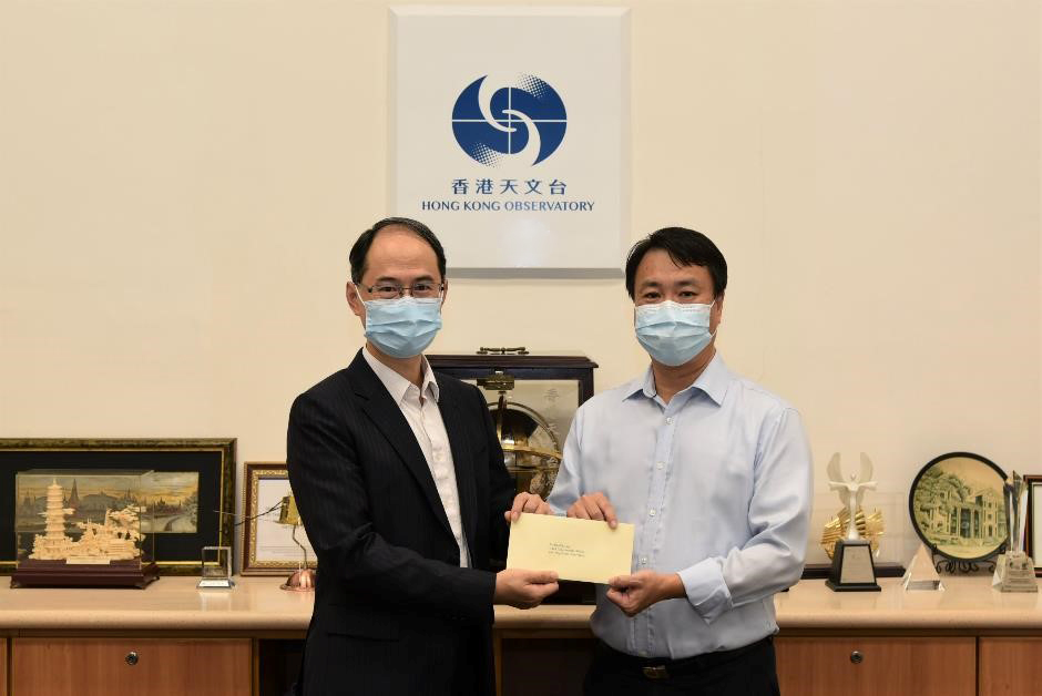 Mr Ho Pak-sing (right) was promoted to Principal Experimental Officer