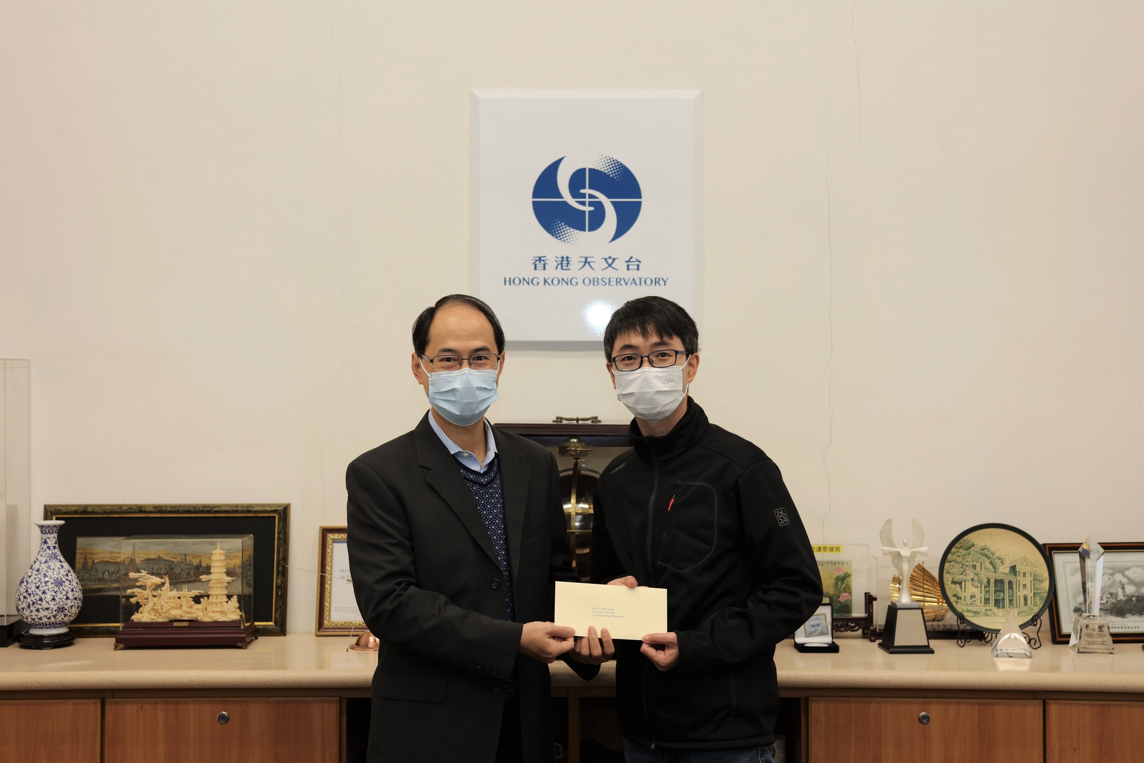 Mr Lo Chin-ming (right) was promoted to Senior Scientific Assistant