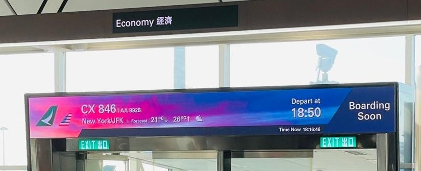 A destination weather forecast is displayed on a newly installed screen at a boarding gate