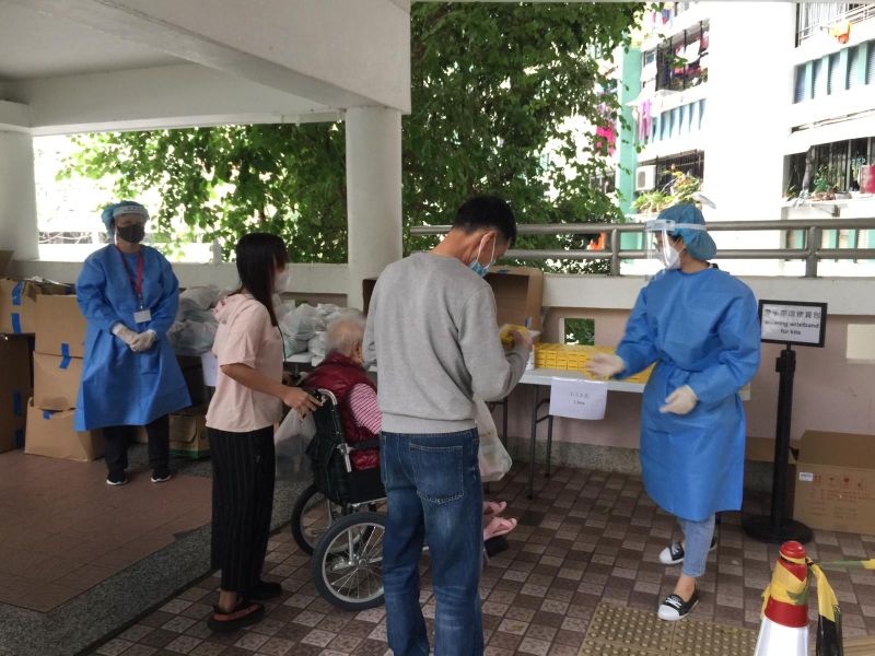 Observatory staff distributing food packs and anti-pandemic kits to residents